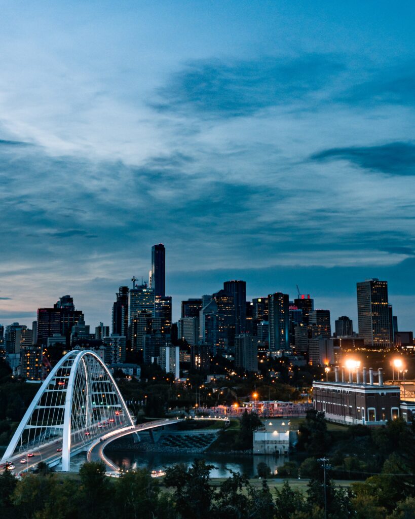 A vertical shot of the busy city reflecting in the river